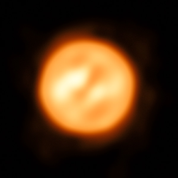 Infrared interferometric reconstruction of Antares’ surface, showing uneven bright regions